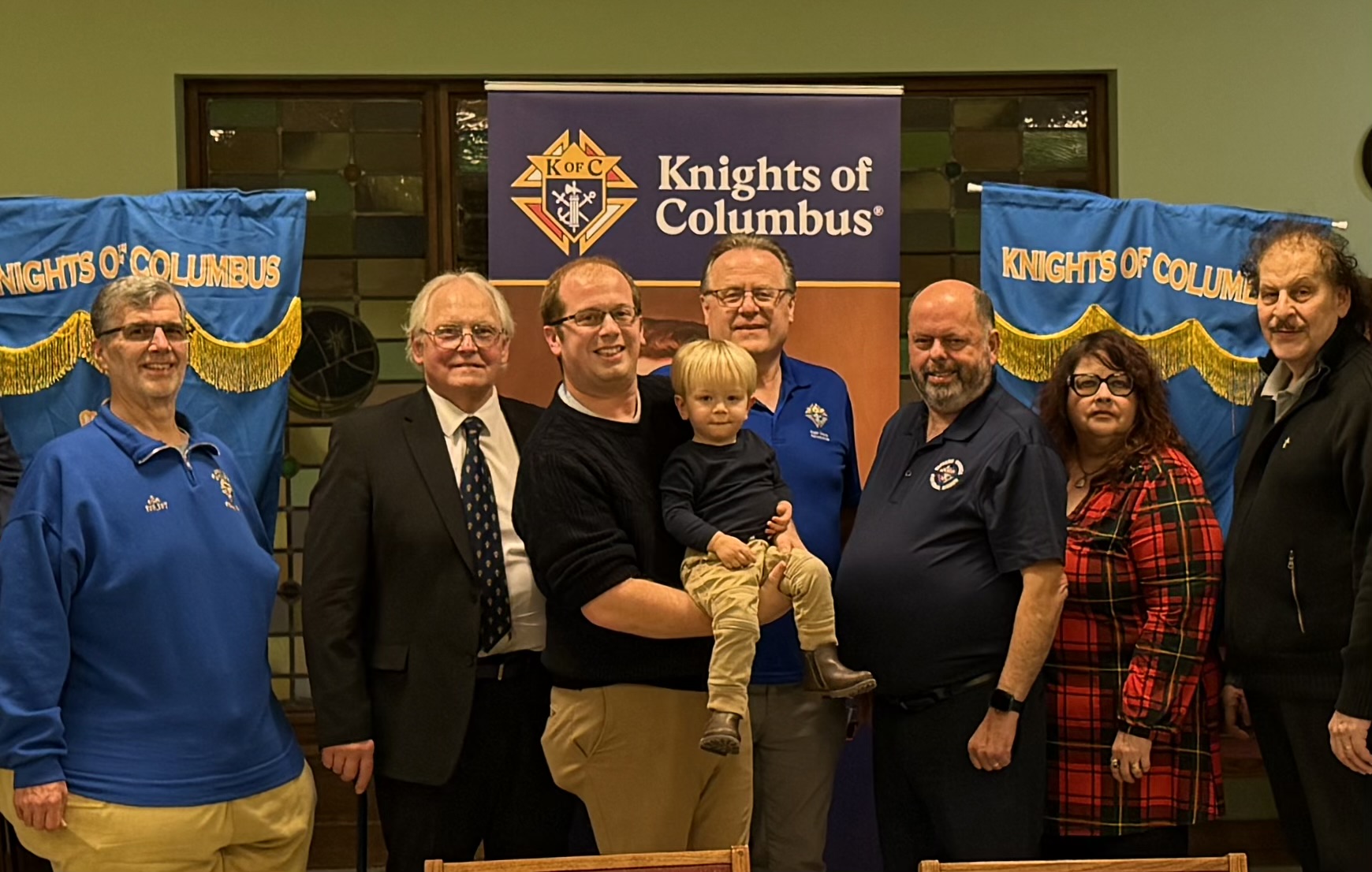 Attendees gather for a group photo at the joint Christmas celebration of Council 12572 and Assembly 938 on January 10, 2026.