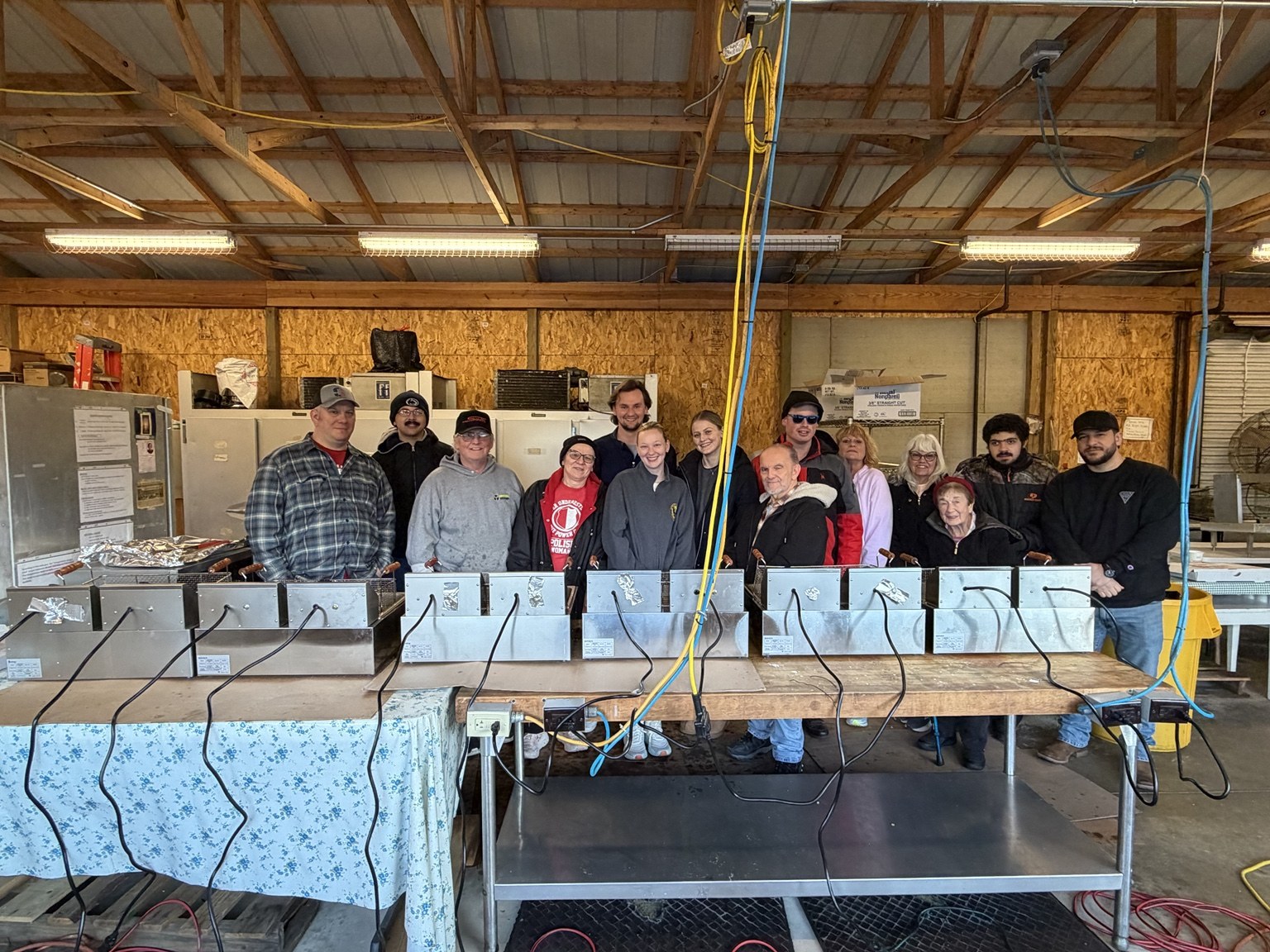 Council Fish Fry volunteers gather behind the fryers on March 13, 2026.